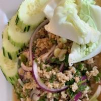 Larb · Your choice of minced chicken/pork mixed with red onion, green onion, mint leaves, cilantro ...