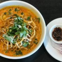 Khao - Soi · The famous Northern Thai egg noodle in creamy curry soup served with a chicken or beef and g...
