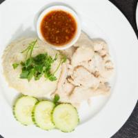 Chicken-Over-Rice · Tender slices of chicken breast served with chicken broth infused jasmine rice, ginger and g...