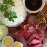 Bbq & Crispy Pork-Over-Rice · Roasted bbq pork and crispy pork served with jasmine rice, hard-boiled egg, and topped with ...