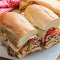 Chicken Sub · Delicious chicken sandwich with provolone, cranberry sauce, mixed greens, Roma tomatoes, may...