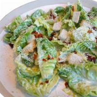Caesar Salad · Crisp romaine salad tossed with croutons and parmesan.