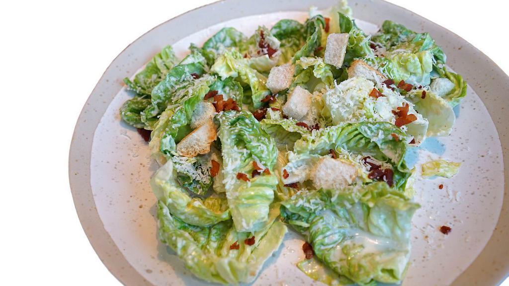 Caesar Salad · Fresh salad with crisp romaine lettuce, garlic croutons, Parmesan cheese and grape tomatoes, mixed with our creamy Caesar dressing and topped with grilled chicken.