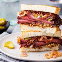 Hollywood Pastrami Sandwich · Juicy sandwich made with thinly sliced turkey pastrami with grilled onions and provolone che...