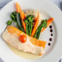 Seared Salmon · Fresh salmon filet seared and topped with a limoncello beurre blanc. Served with seasonal ve...