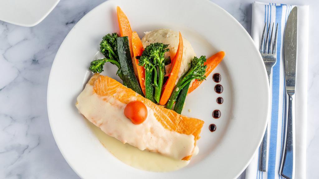 Seared Salmon · Fresh salmon filet seared and topped with a limoncello beurre blanc. Served with seasonal vegetables and creamy potatoes
