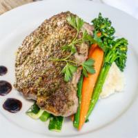 Prime Rib Eye Steak · Marinated in herbs, garlic and pepper. Served with herb butter, seasonal vegetables and crea...