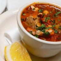 Spicy Chicken Garbanzo Soup · A spicy broth stewed with garbanzo bean, potato, carrot, onions, celery tomato, oregano, par...