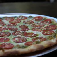 Large Tomato Pesto Pizza · Basil pesto, fresh mozzarella, feta cheese, sliced tomatoes