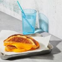 Classic Grilled Cheese · Melted american cheese between two slices of buttery grilled bread.