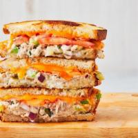 Tuna Melt · Melted cheddar, house made tuna salad, and sliced tomato between two slices of buttery grill...