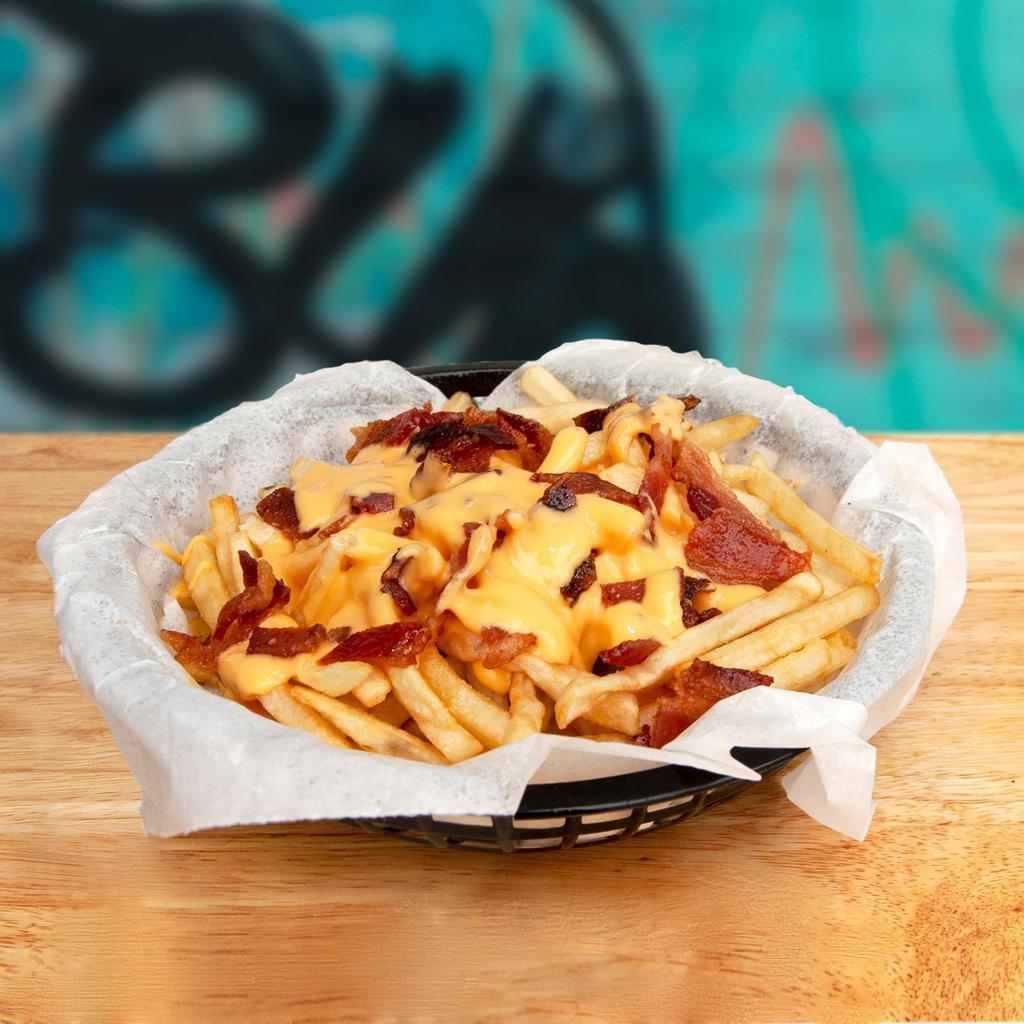 Grilled Cheese Fries · Melted American cheese, golden French fries, and crispy bacon between two slices of buttery grilled bread.