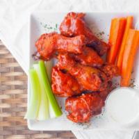 Tap Boneless Wings · Tossed with choice of  Mango Habanero, Buffalo, Spicy BBQ, Honey BBQ, Sweet Thai Chili, or D...