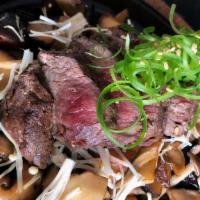 Wagyu Beef Skillet · Beef medallion, shimeji, shitake, teriyaki and green onion.