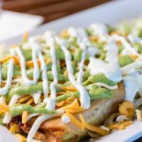 Taquitos (Corn) · Four rolled tortillas, deep-fried and topped with lettuce, pico de gallo, avocado sauce, crè...