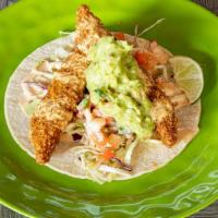 Baja Fish Taco · A corn tortilla with breaded white fish. Cabbage, fresh pico de gallo, guacamole sauce and o...