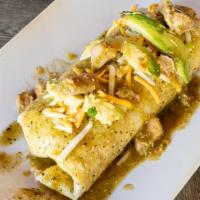Pork Chili Verde Burrito · Savory chunks of carnitas, homemade spanish rice and refried beans. Topped with salsa verde,...