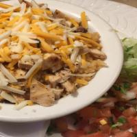 Chicken Bowl · Grilled chicken breast, pinto beans, spanish rice and cheese. Garnished with baja sauce, let...