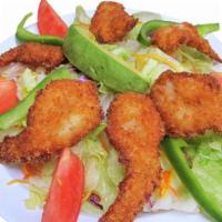 Shrimp Salad · Delicious breaded shrimp on crispy green lettuce with avocado, bell peppers, cheese, tomato,...