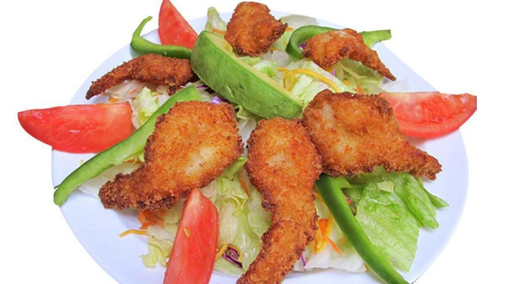 Shrimp Salad · Delicious breaded shrimp on crispy green lettuce with avocado, bell peppers, cheese, tomato, and our delicious home dressing.