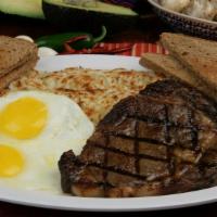 Steak & Eggs · Juicy rib eye steak, two eggs.