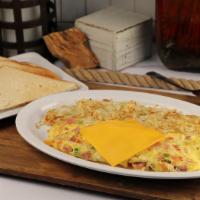 Denver Omelette · Hearty omelet stuffed with diced ham, tomato, onions, bell pepper, and American cheese.