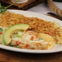 Veggie Omelette · Hearty omelette stuffed with bell peppers, onion, tomato and shredded cheddar cheese. Topped...