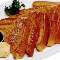French Toast · Six triangular slices of french toast with powdered sugar.