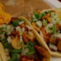 Two Tacos Plate · Two soft tacos with your choice of meat topped with cilantro and onions. Served with rice an...