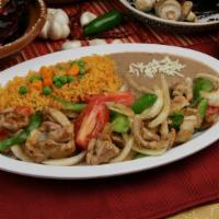Chicken Fajitas · Grilled chicken with sautéed bell peppers, cilantro, and onions. Served with rice, beans, an...
