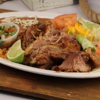 Carnitas Plate · Mexican style pork carnitas served with rice, beans, salad, and tortillas.
