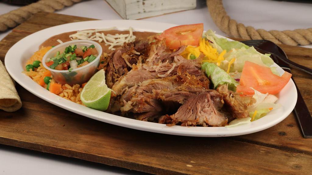 Carnitas Plate · Mexican style pork carnitas served with rice, beans, salad, and tortillas.