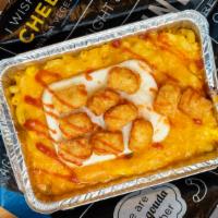 Hangover · Cheddar Mac with fried or scrambled eggs, pepper, and onions topped with tator tots drizzled...