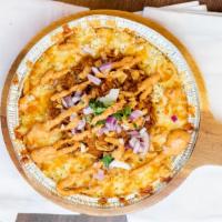 This Little Piggy Got Pulled · White cheddar mac with bbq pulled pork, crispy onions, red onions, cilantro, and spicy chipo...