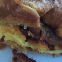 Breakfast Croissant · Eggs, cheese and choice of bacon, sausage or ham. Served with fresh fruit, cottage cheese or...
