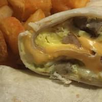 Breakfast Burrito · Filled with eggs, onions, bell peppers, cheese, and sausage. Served with breakfast potatoes,...