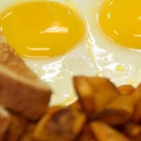 2 Egg Breakfast No Meat · Two eggs cooked to order, breakfast potatoes, and toast.