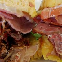 Deli Melt Sandwich Combo · Pastrami, salami, capicola, provolone cheese, served hot on a toasted onion roll. We are com...
