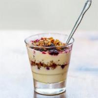 Yogurt Parfait · Organic plain Greek yogurt with berries, granola and honey drizzle.