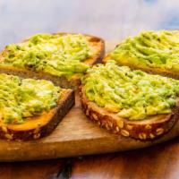 Avocado Toast · w/ Mashed Avocado, Red Pepper Hummus, Olive Oil, Salt & Pepper.