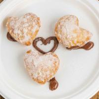 Zeppole Alla Nutella · Deep-fried dough stuffed with nutella, coated with sugar.