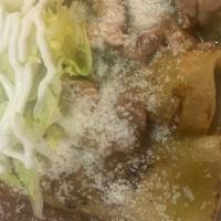 Pollo Enchiladas · 3 red enchiladas con frijoles, arroz enselada verde
