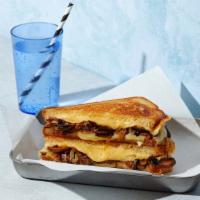The Mushroom · Melted Swiss and Havarti cheese with roasted mushrooms, caramelized onions, balsamic and may...