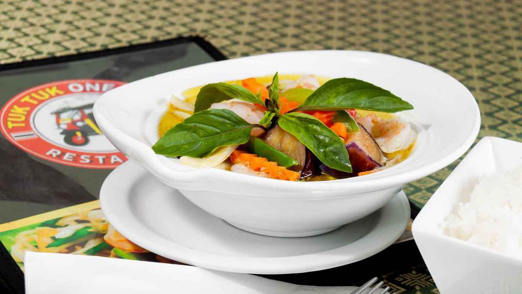 Green Curry · Pea carrot, bell pepper, bamboo shoot, eggplant, and Thai basil with coconut milk. Served with steamed rice.