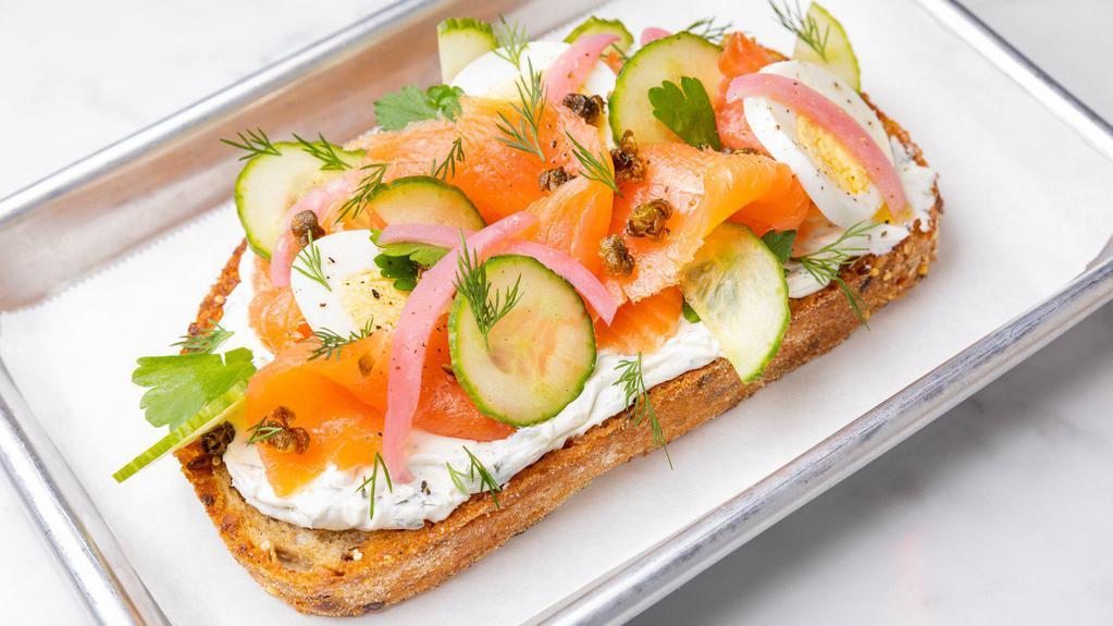 Smoked Salmon Droptop · Dill Cream Cheese, Pickled Red Onion, Crispy Capers, Hard Boiled Egg, Cucumber, on Multigrain.