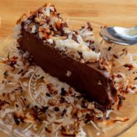 Dark Chocolate Ganache Mud Pie · Roasted coconut crust with dark chocolate ganache