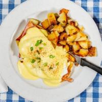 Eggs Benedict · Annie's honey ham, two poached eggs on english muffin topped with hollandaise sauce. Served ...