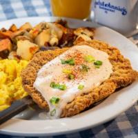 Chicken Fried Steak And Eggs · Chicken fried steak with country gravy and two eggs any style. Served with fruit or potatoes...