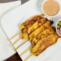 Chicken Or Pork Satay · Sliced chicken marinated with Thai style sauce, grilled and served with peanut and cucumber ...