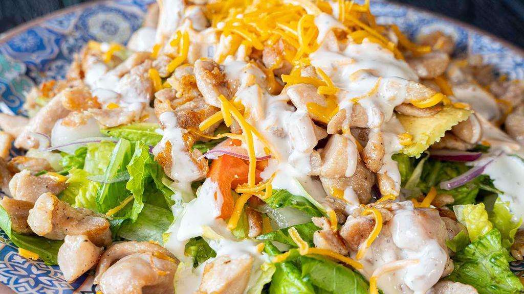 Chicken Salad · Hot grilled chicken, no skin, served over romaine lettuce, tomato, avocado, and cheese; choose, ranch or vinegar and oil dressing.